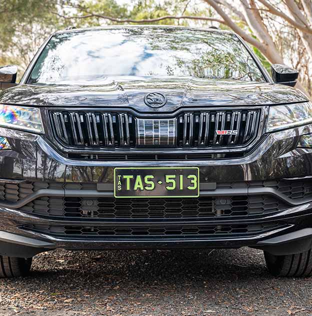 Colour on Black Green on black plate on a Black Skoda
