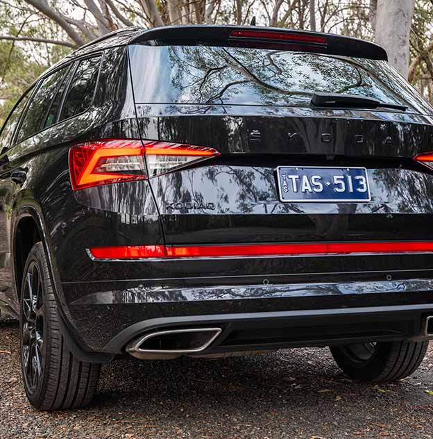 Black Skoda with MyColour White on dark blue plate