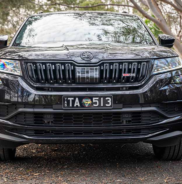 Sports and Leisure Targa Mustang plate on a Black Skoda