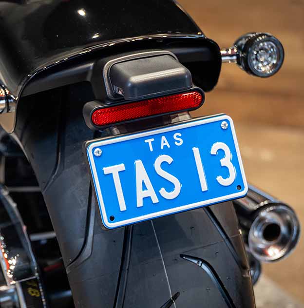 Motorcycle 3 white on light blue plate