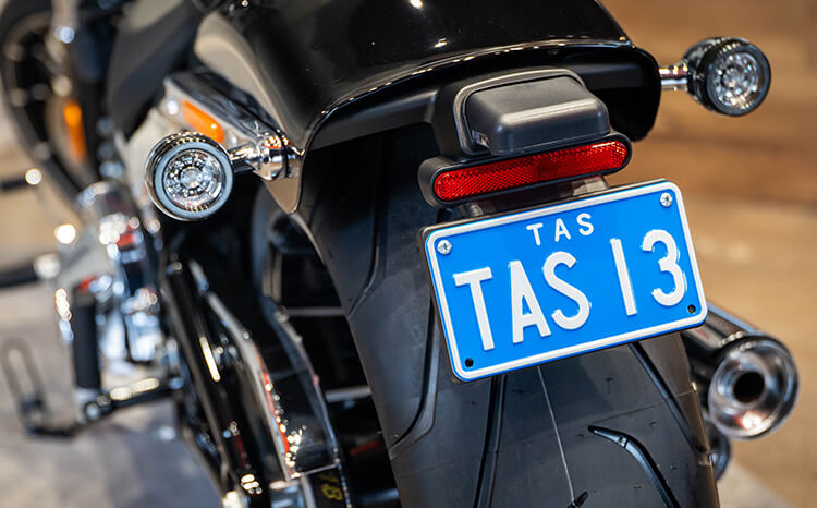 Motorcycle - White on Light Blue Plate